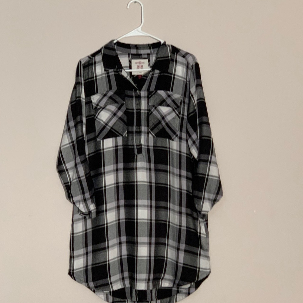 A plaid black and white shirt dress